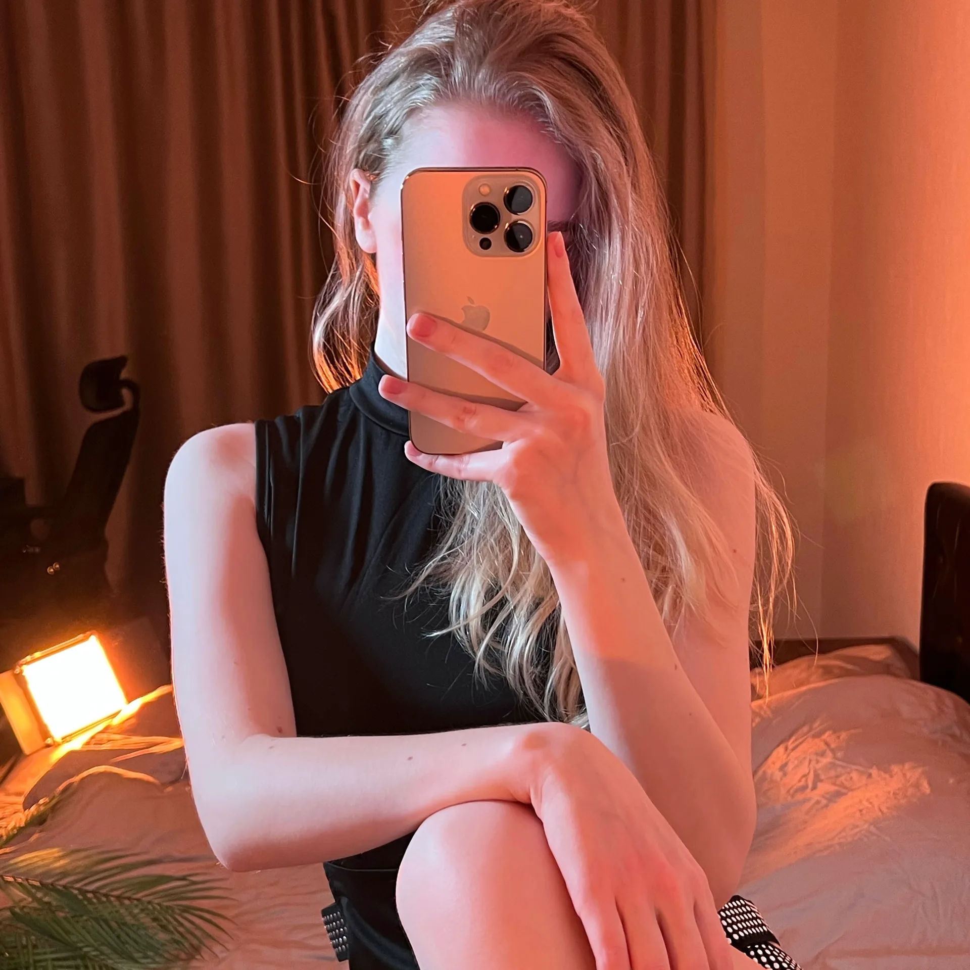 Black sleeveless top mirror selfie