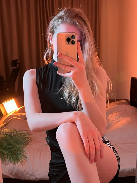 Black top in a bedroom mirror