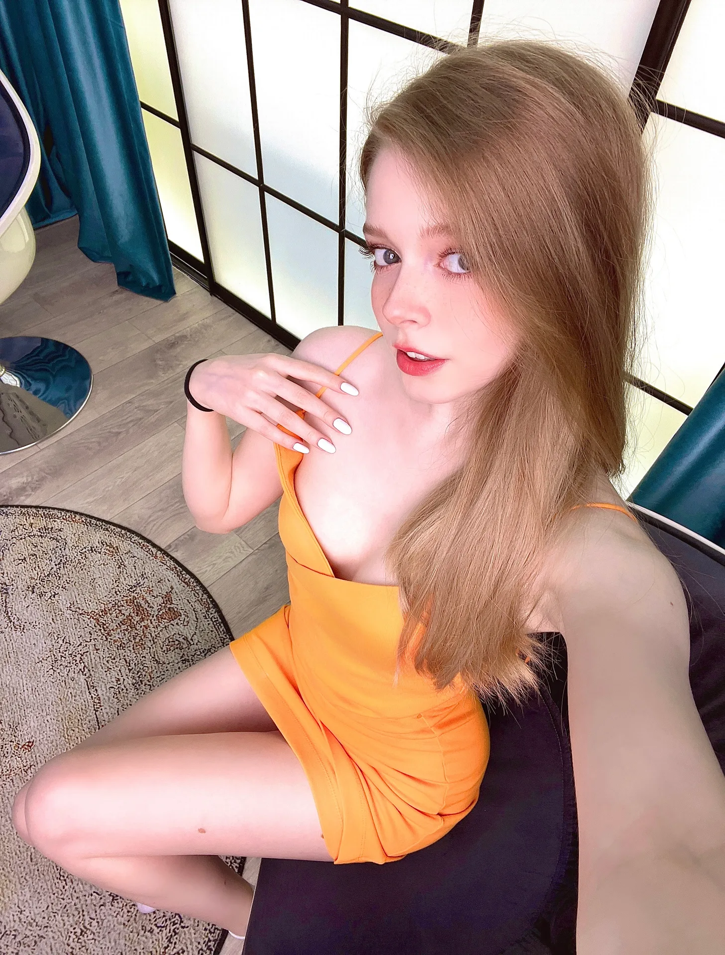 Orange dress on a dark chair