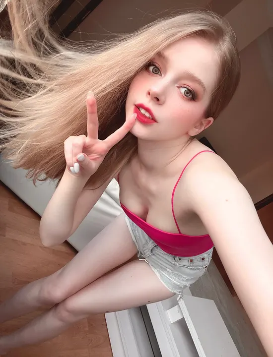 Pink crop top and denim shorts