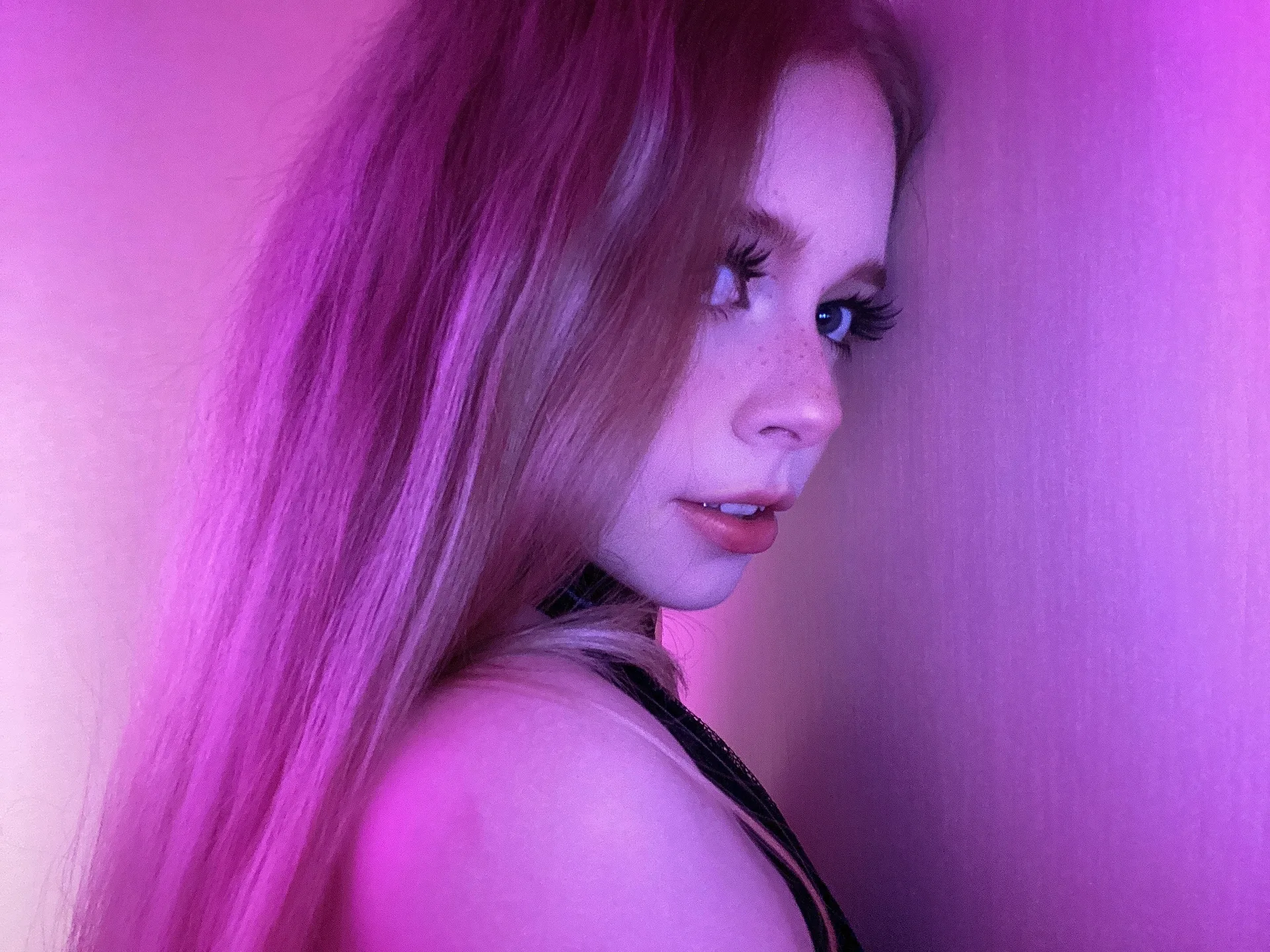 Pink hair in purple light