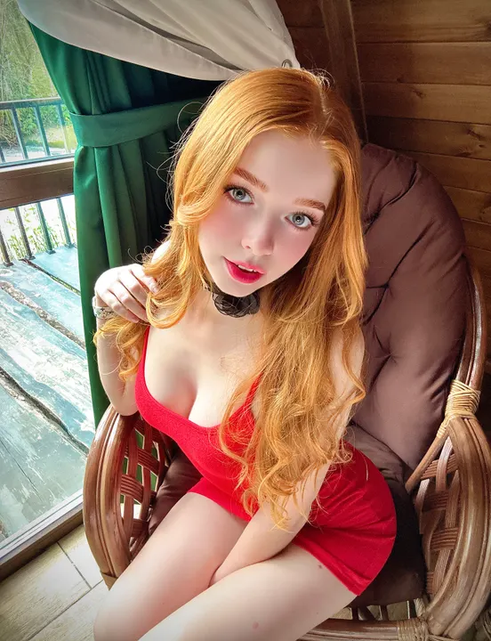 Red dress in a wicker chair