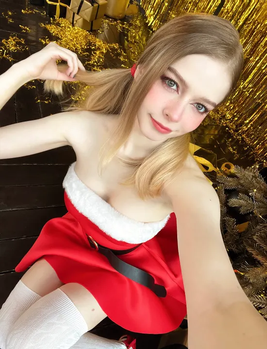 Santa dress by a Christmas tree